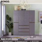 A gray Noble Cupboard with model number BFC009 displayed in a room setting, featuring multiple doors and drawers with a modern design.